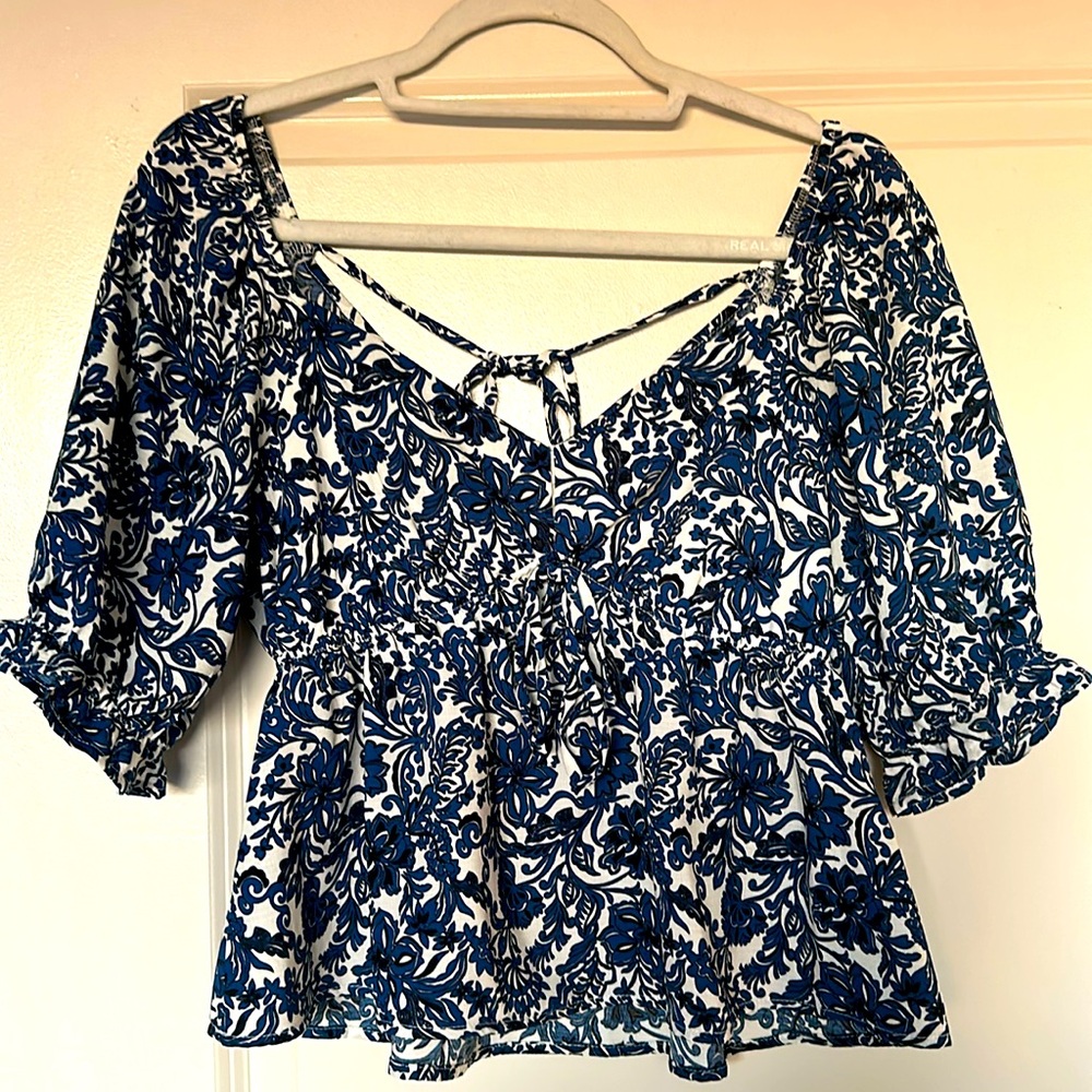 "The General Good" V-Neck Camille Back Detail & White Floral Blouse